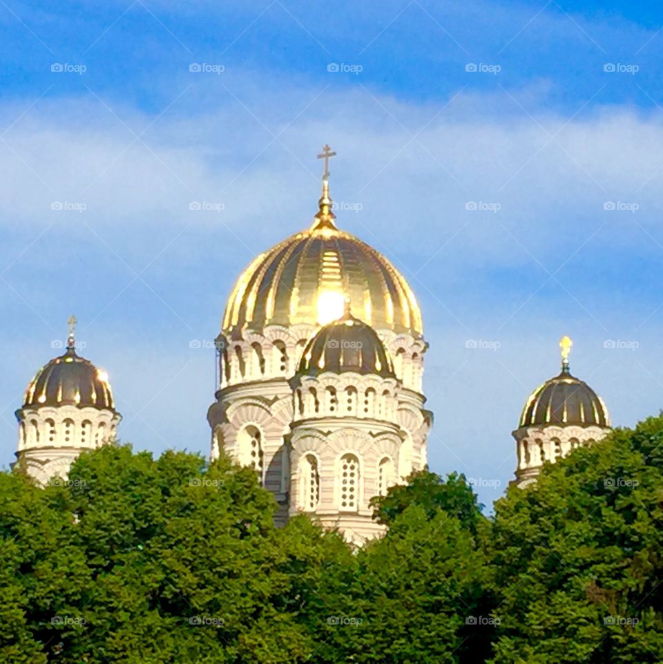 A golden dome of a protestant church in Riga Latvia. UNESCO heritage list.