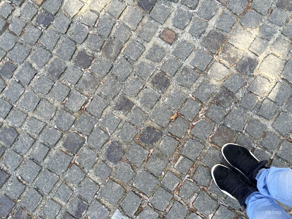 A sidewalk of small bricks