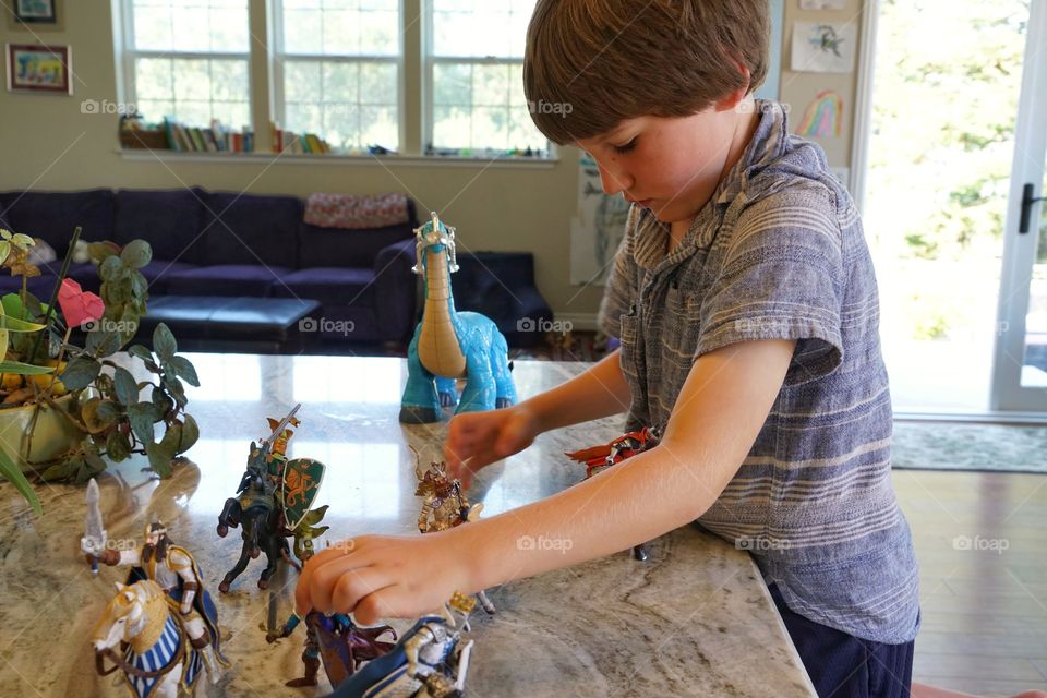 Young Boy Playing With Toys