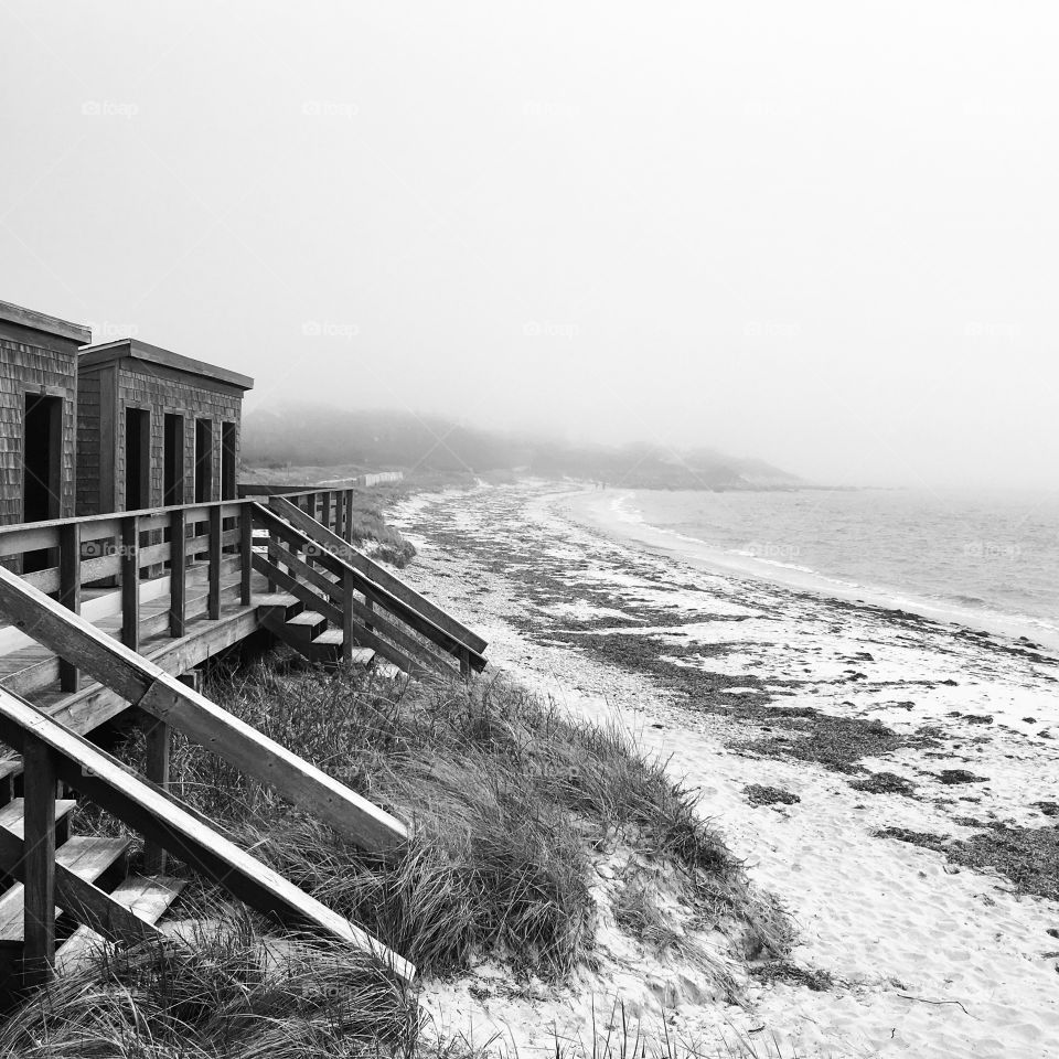 Foggy morning at the beach in black and white 