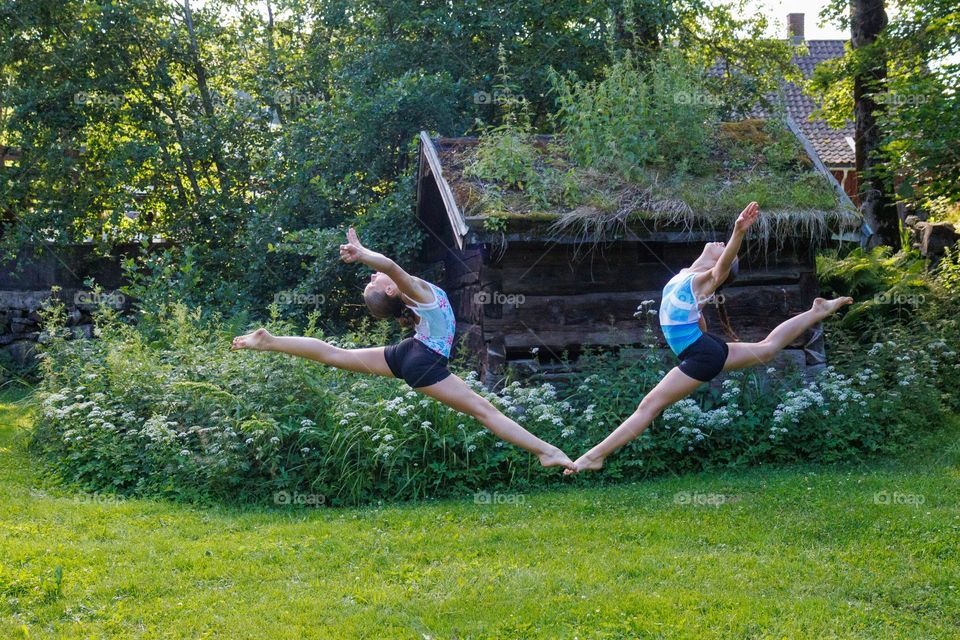 At the Green arena in the beach this Girls makes fun moves for fun .Hey its summer time and sun ,and its holliday