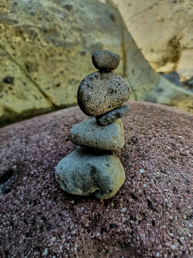 Stack of stones balancing on the river