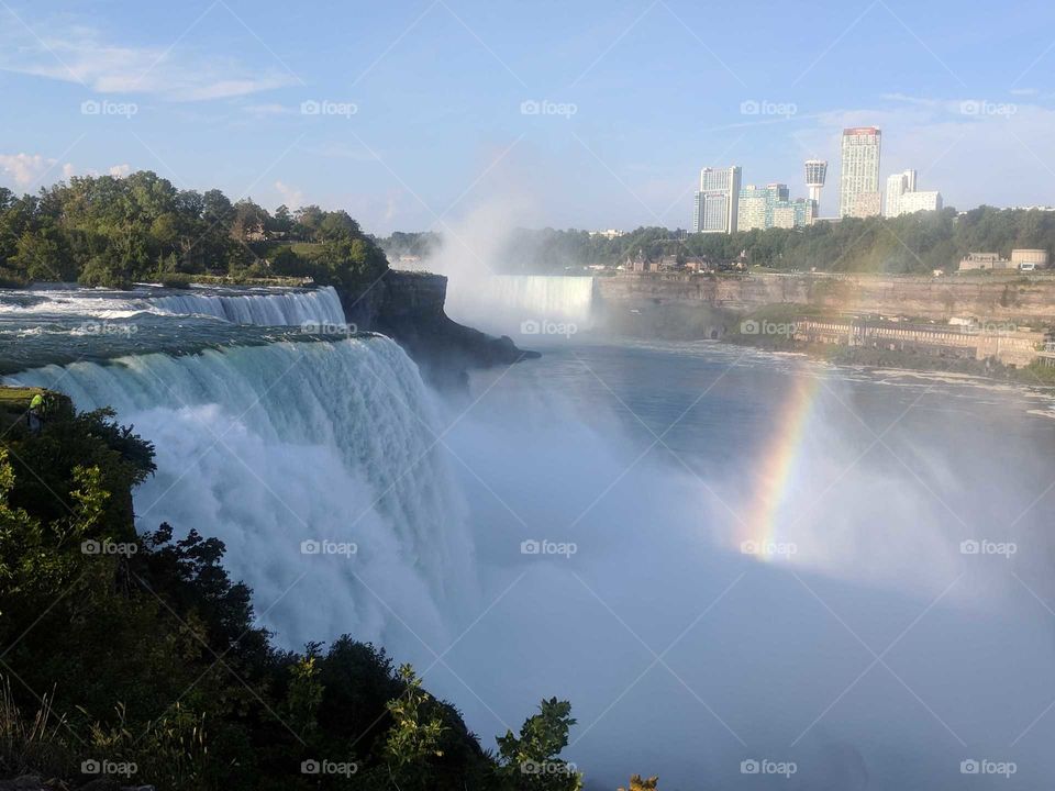 Early Morning at Niagara Falls, on the American Side in New York, with a Rainbow Breaking Through the Rushing Water of the Waterfalls