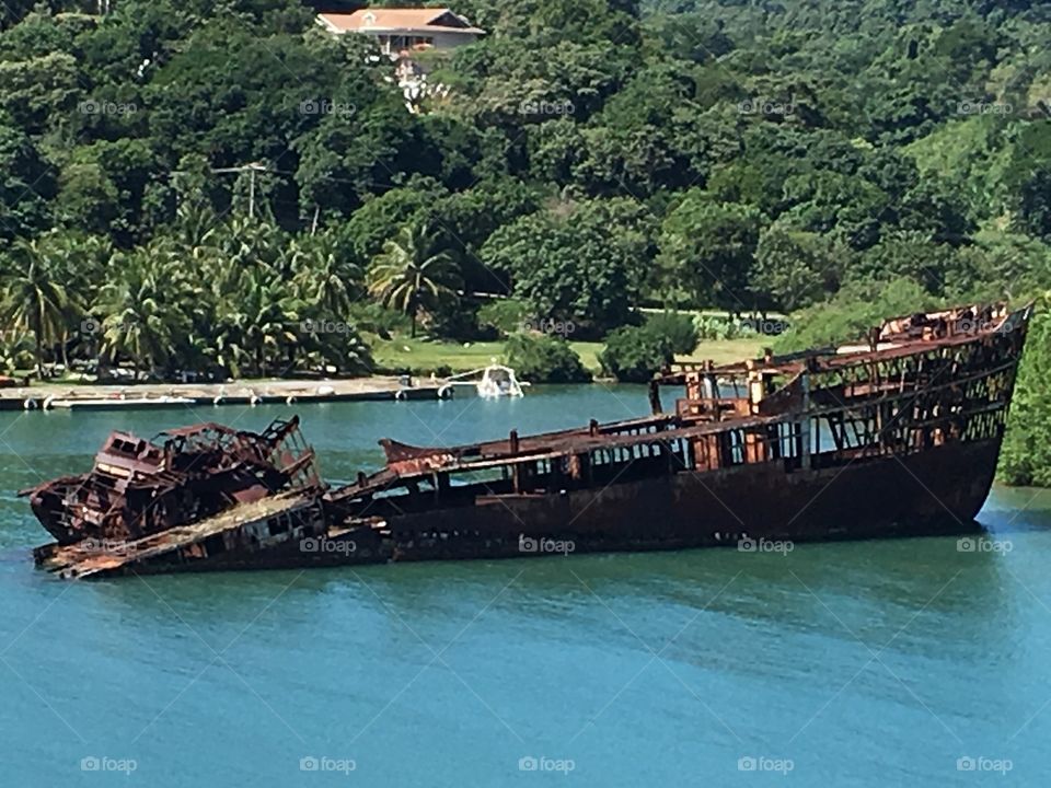 Sunken ship in tropical bay