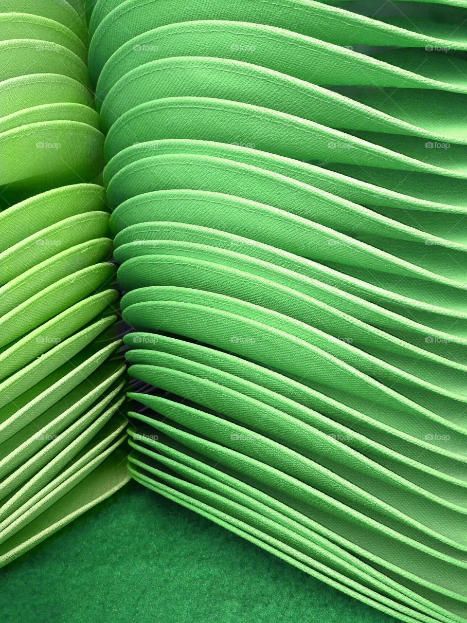 Stack of green hats.