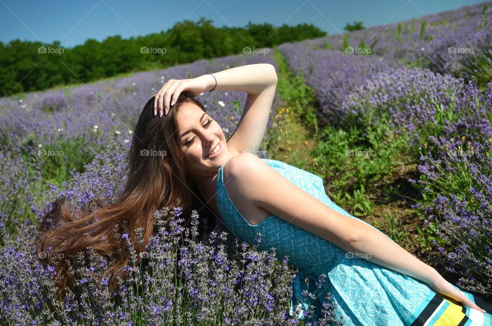 Portrait of Beautiful Young Girl on Lavender Field