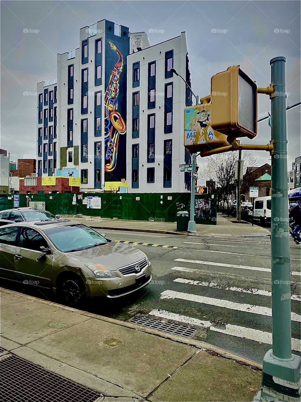 And from another angle, here it is again, the slightly futuristic and slightly “Art Deco” nostalgic inspired “Jazzy” building that is still under construction featuring a super sleek prime color mural of a saxophone. 2023. Hypnotic Productions