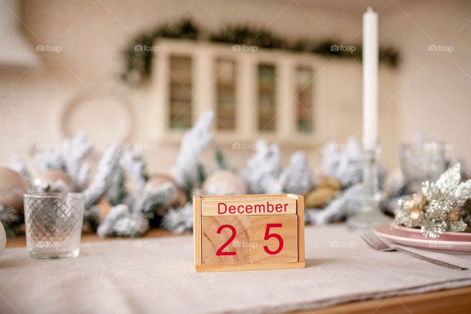 Christmas background with wooden block calendar with the date of December 25