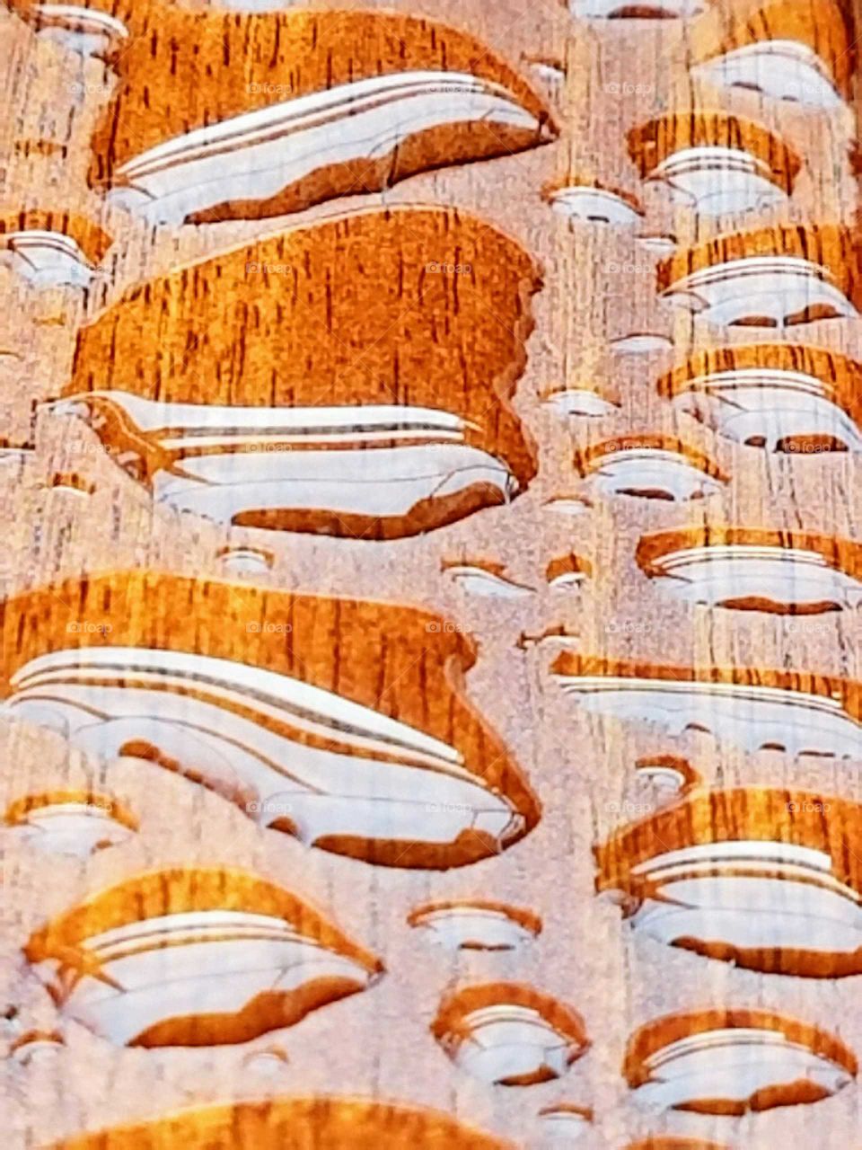 Full frame of water drop on woodgrain