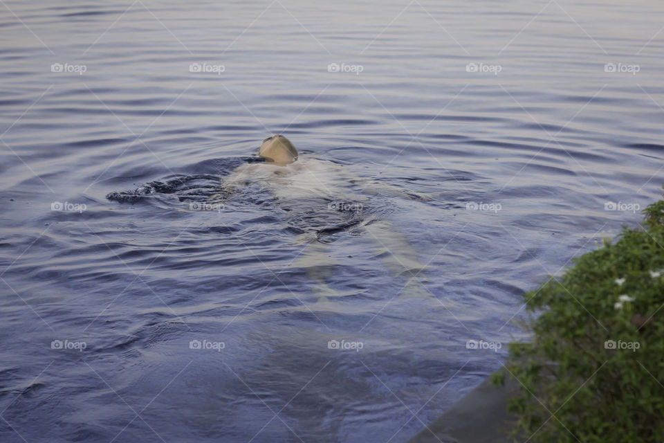 Me floating in the pool.