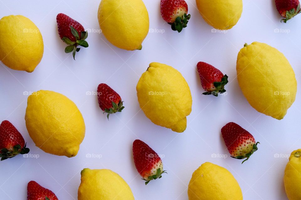 lemons and strawberry on a white background