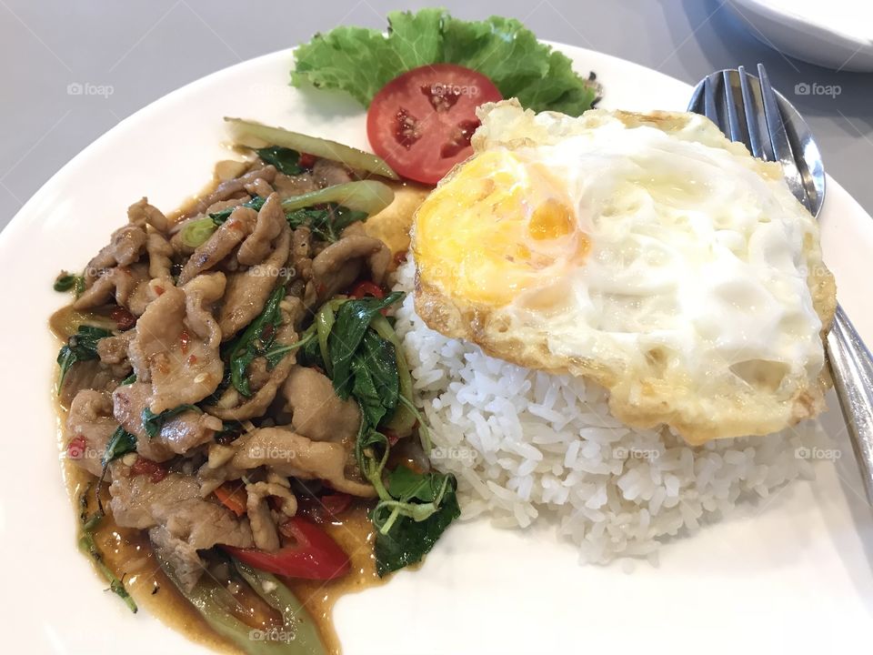 Signature Thai food “Stir-fried pork and basil with Steamed rice”
