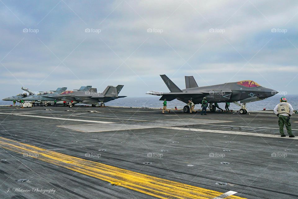 A F-35C prepares for takeoff from a carrier deck in order to participate in a training mission