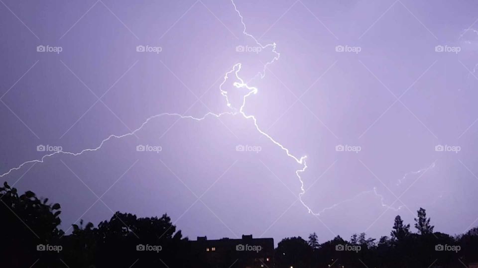 A lightning in the purple sky