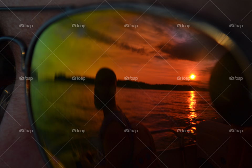Reflection of Sunset in sunglasses 