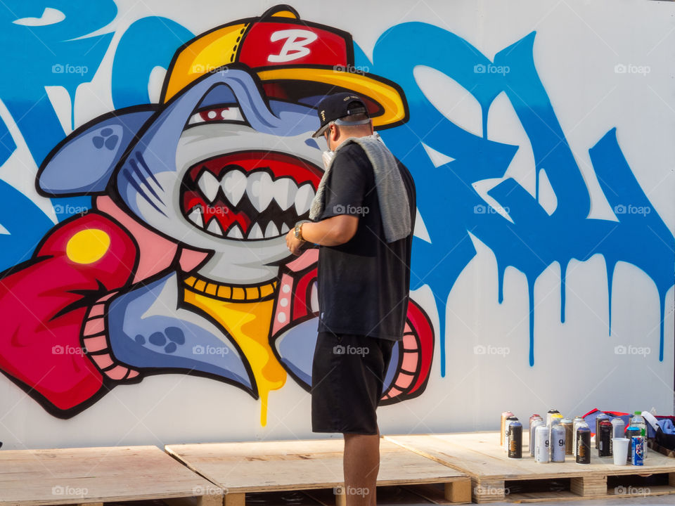 Graffiti artist doing his thing