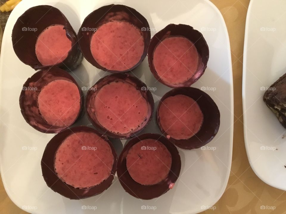 Chocolate cup with raspberry mousse