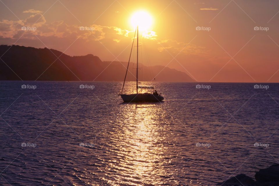 Boat in the sea at sunset