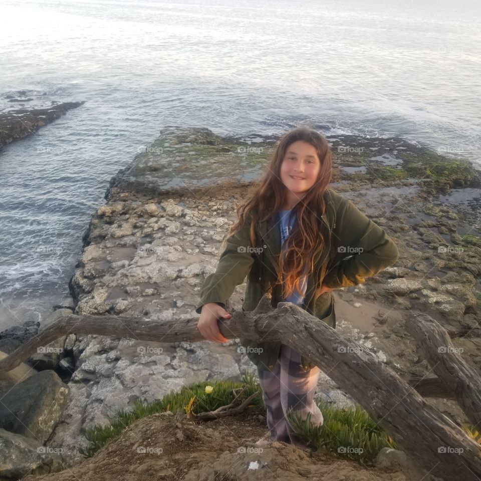 enjoying an evening leisurely walk when we find the perfect spot for a photo by the ocean