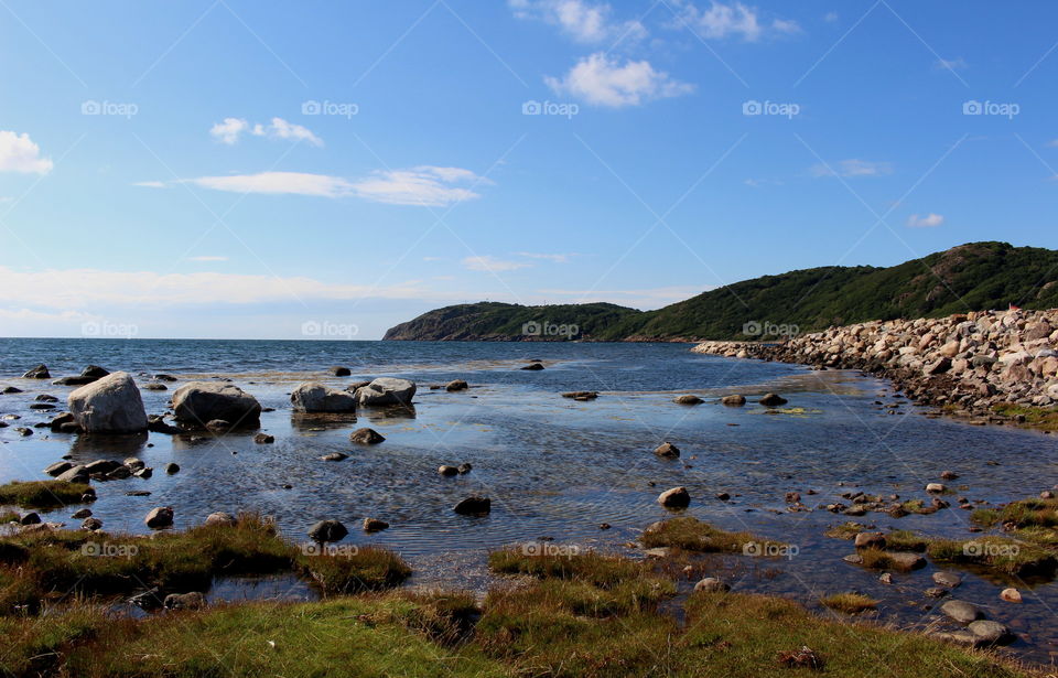 Scenic view of a sea against blue sky