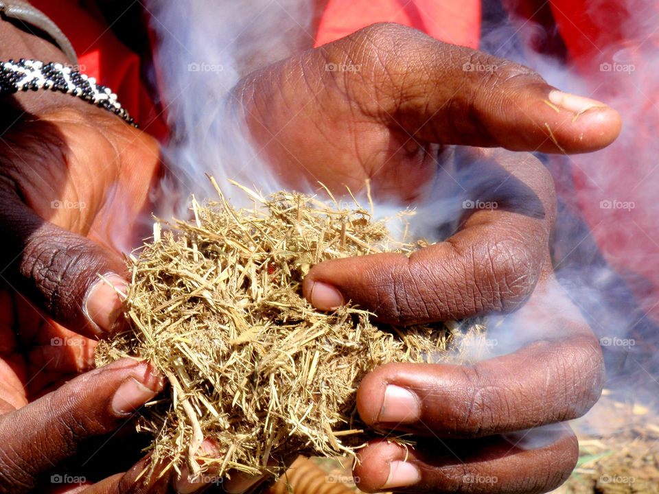 Maasai men making fire