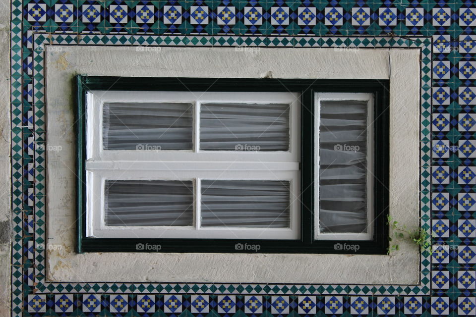 Window and Tile on Lisbon. Portugese hand Painted Tiles and Window