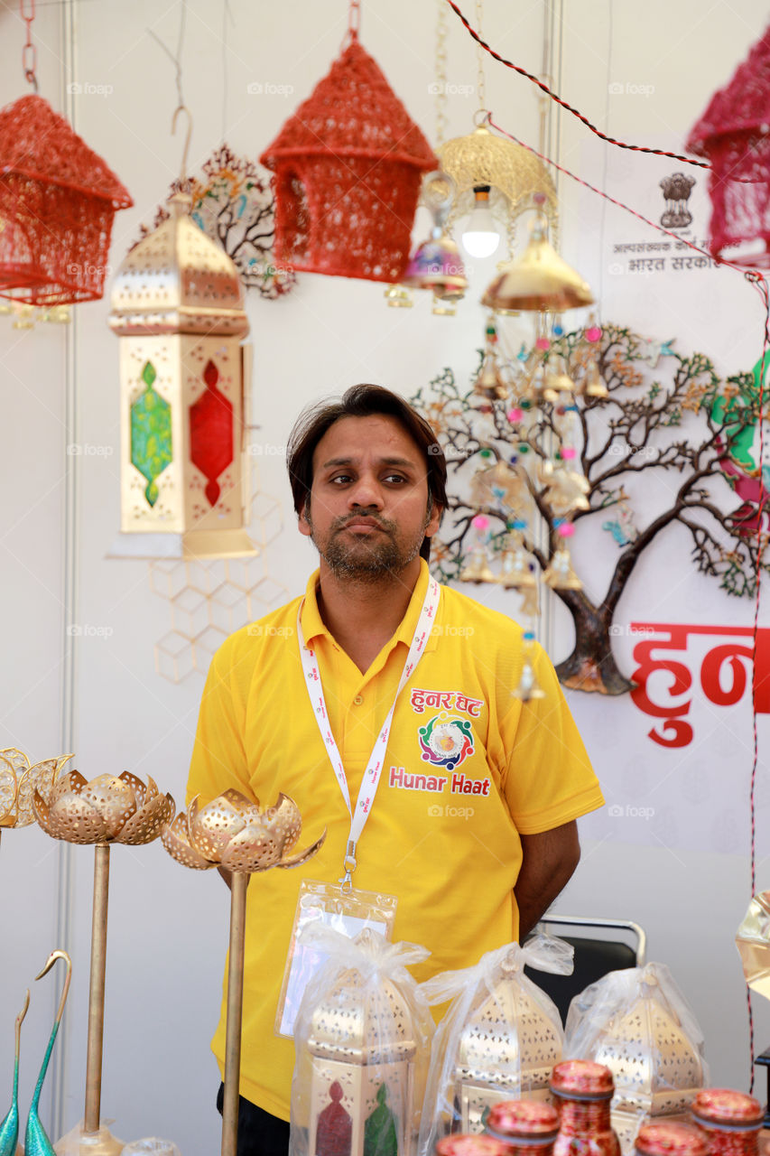 A seller of lamps at the Hunar Haat, New Delhi, India