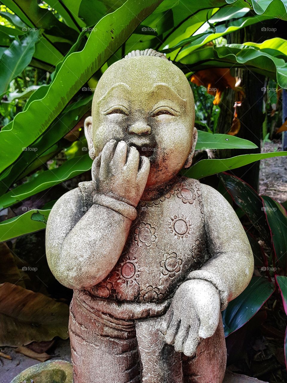 Laughing statue in garden