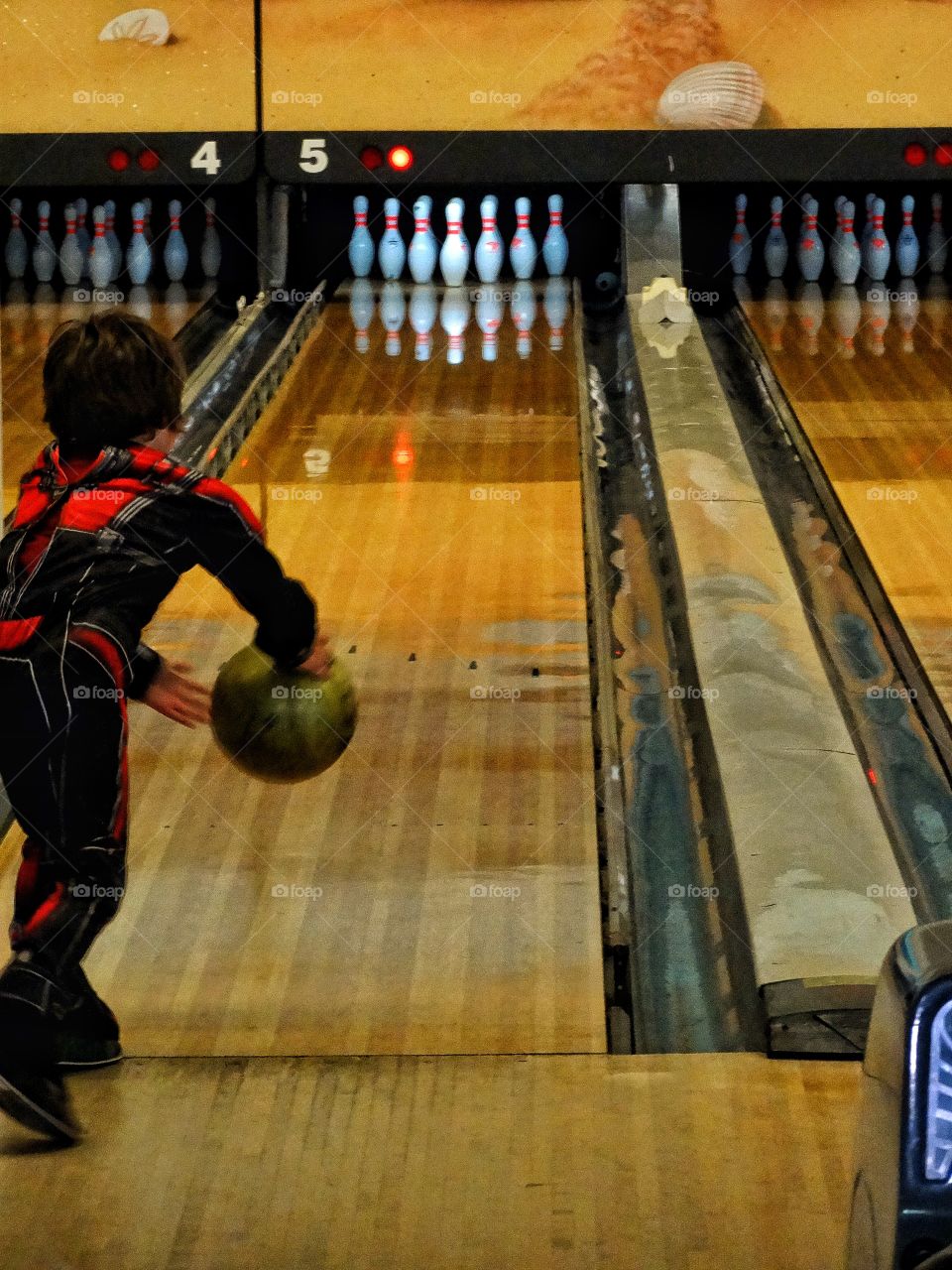 Boy Throwing A Bowling Ball
