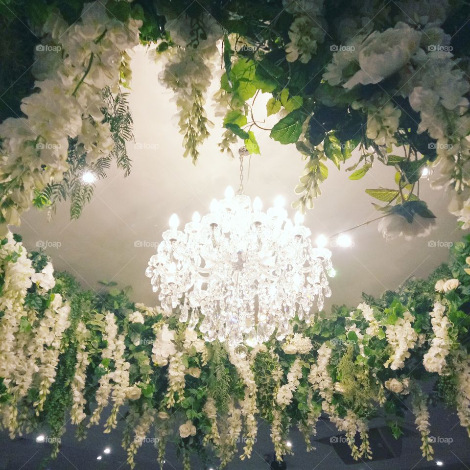 stunning hanging wedding flowers with antique chandelier