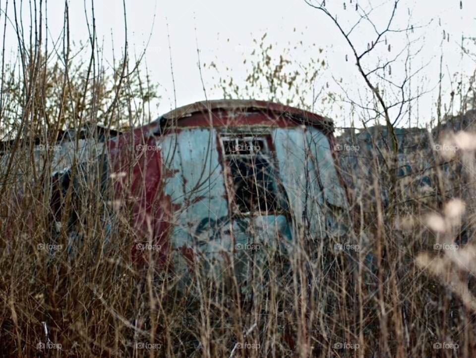 Blue abandoned caravan 