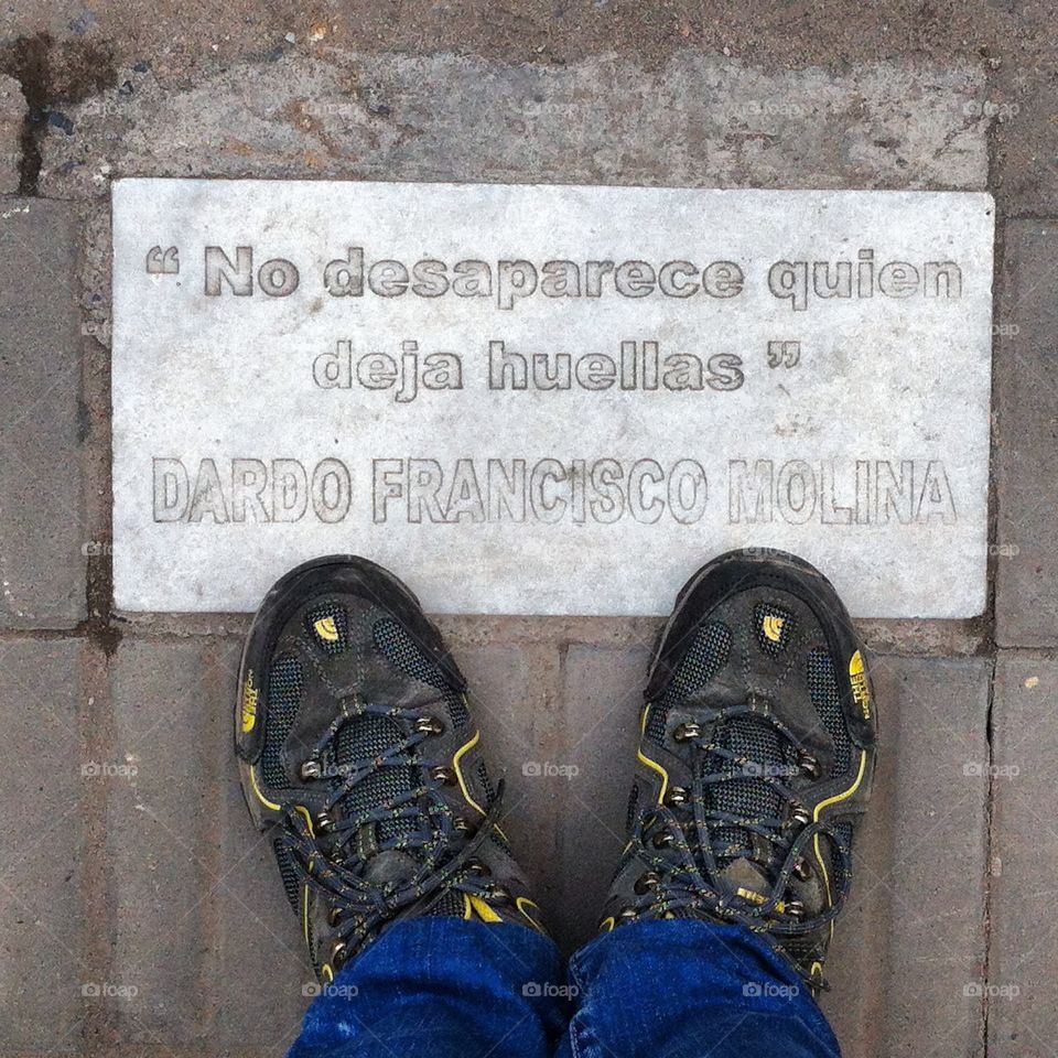 Floor sign . Urban wisdom on a sidewalk on Tucuman, Argentina. 