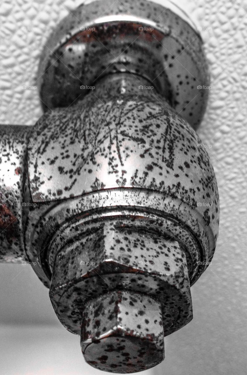 Rusted water valve black-and-white