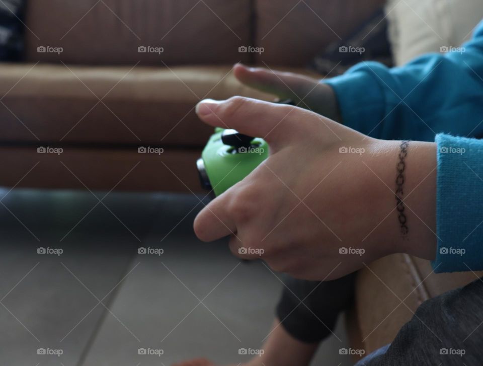 Kid’s Hands playing on Xbox 