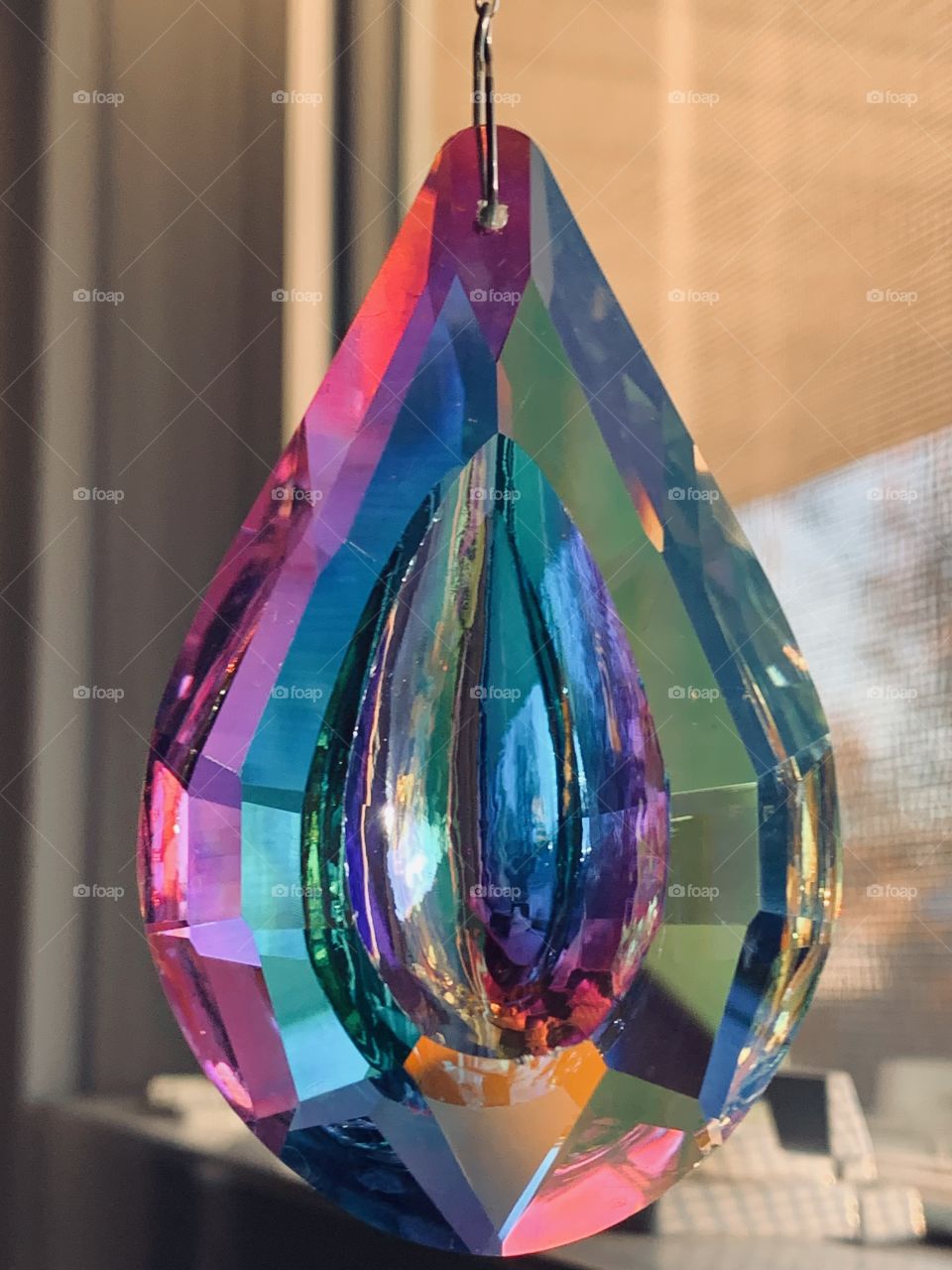 A plastic crystal window hanging. It picks up the light and casts dancing rainbows across the room. 