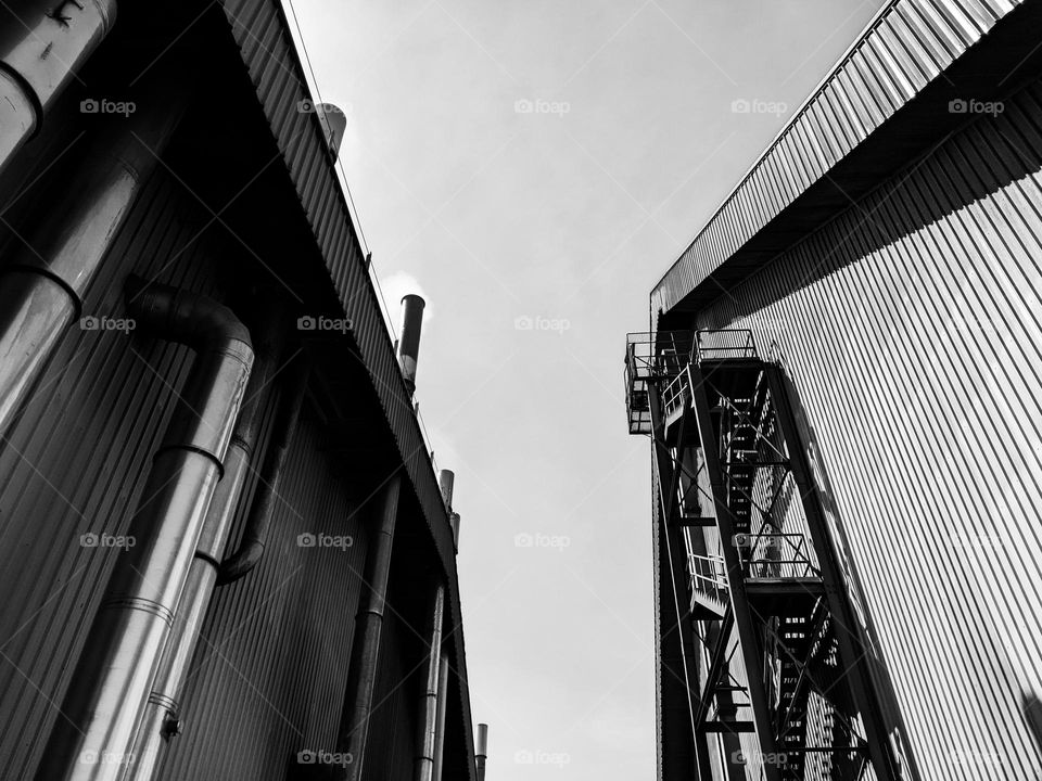 A black and white kernel processing plant and kernel dust warehouse