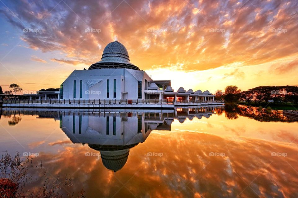 Reflections of mosque during sunrise