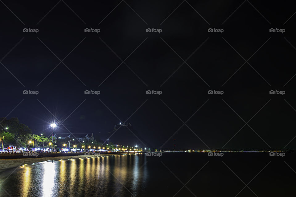 The lights on road at night Background Sea  at Prachuap Bay in Thailand.