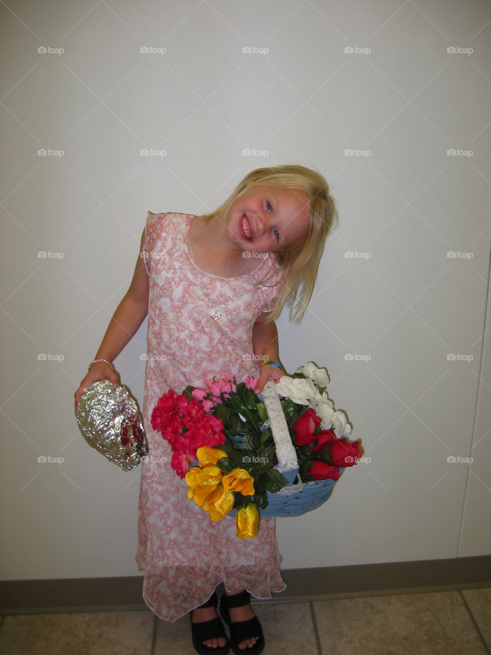 Portrait of smiling girl carrying bouquet
