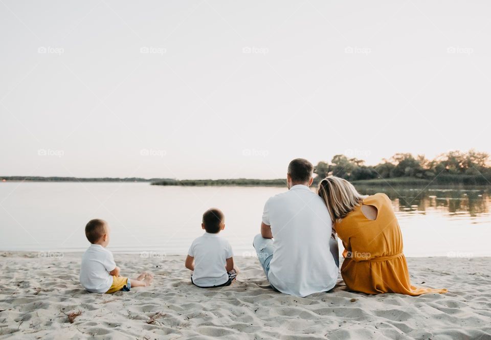 Family sitting on the beach