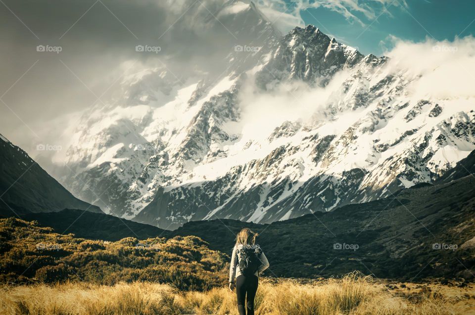 Facing the Mountain - Hiker Approaching Imposing Mountain