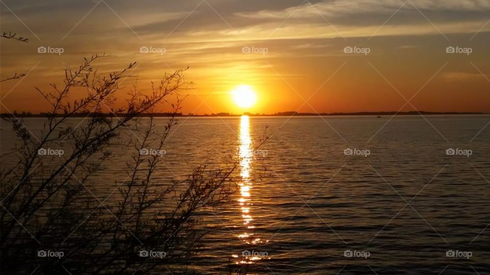 Contemplating the greatest spectacle on earth! Sunset on Lake Guaíba - Rio Grande do Sul - Porto Alegre - Brazil.