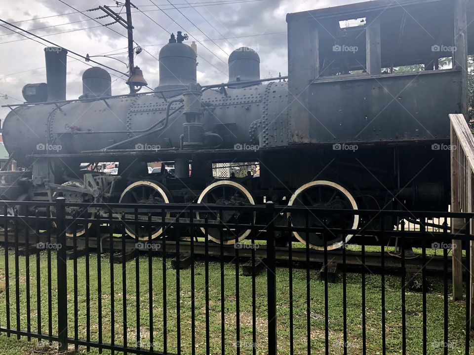 Very old train in Louisianna  on display outdoors  in the twin square.,