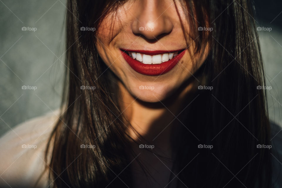 Smiling woman with red lips 