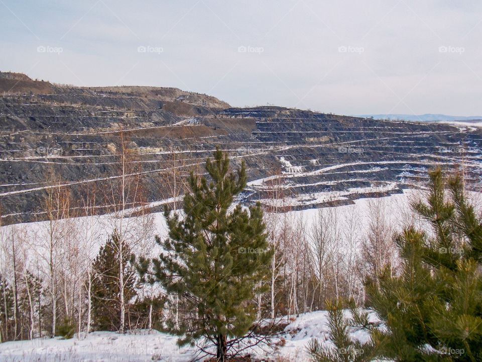 Pervomaysky quarry of the Zavitinsky lithium deposit. Shilkinsky district, Zabaykalsky krai, Siberia, Russia.