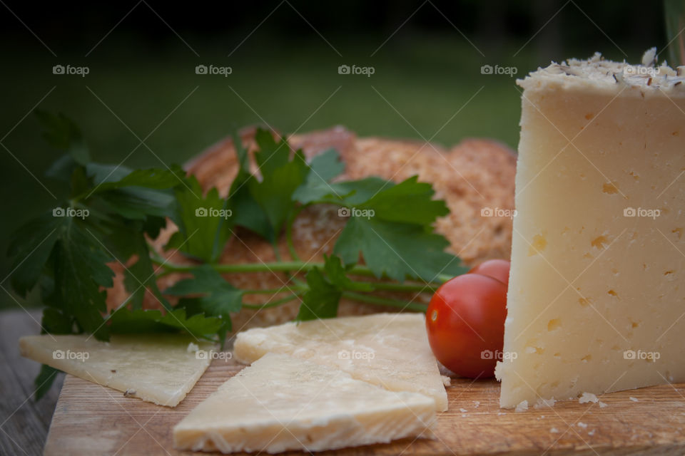 Slice of cheese and cherry tomatoes with bread 