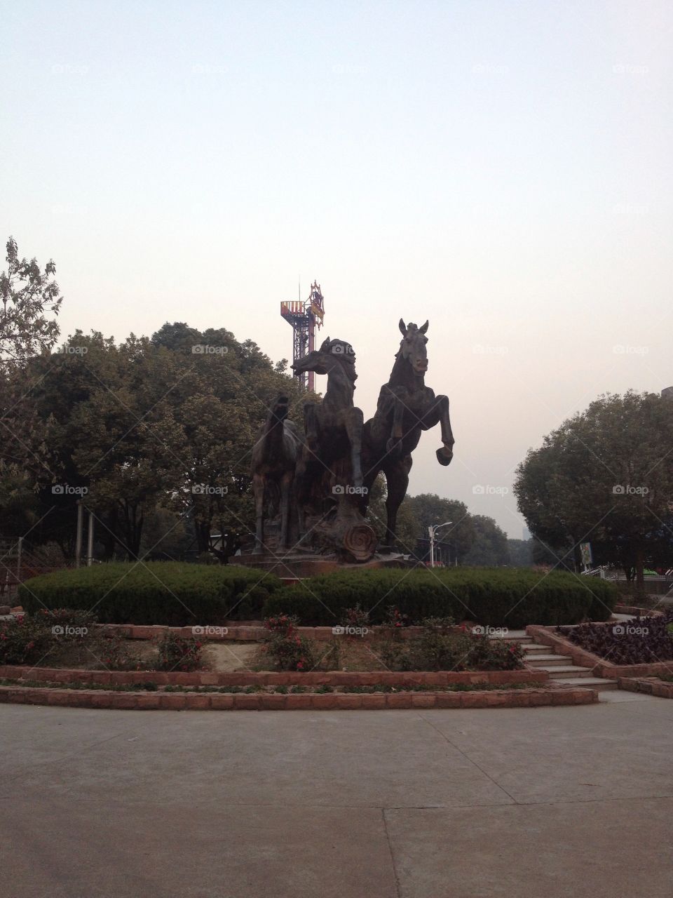 Statue of three horses in a park