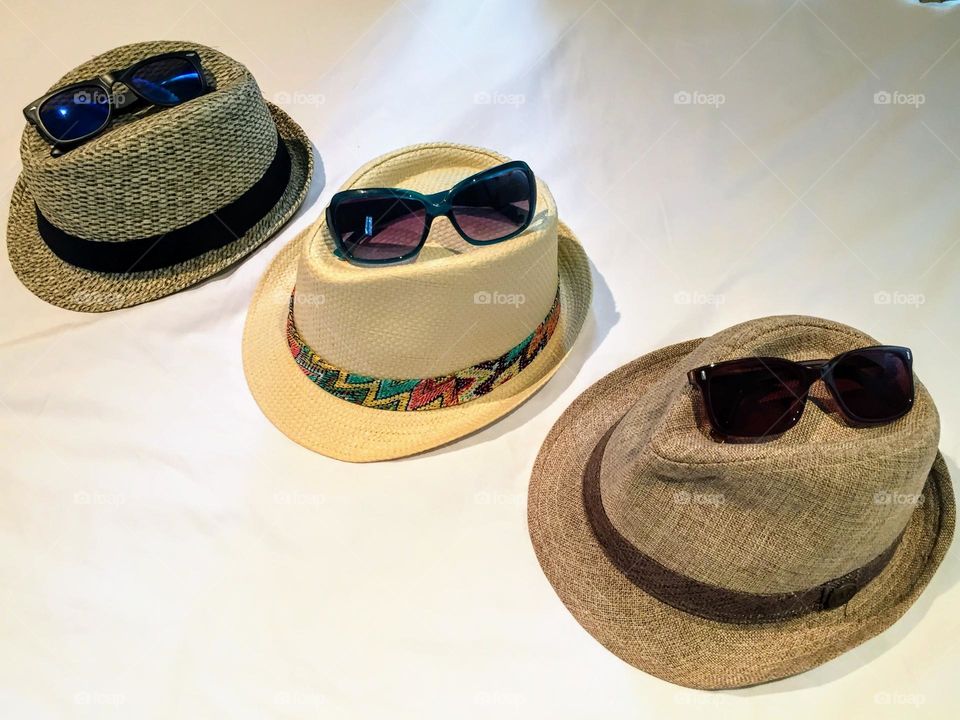 Vacation Products: three fedora hats in row with sunglasses 