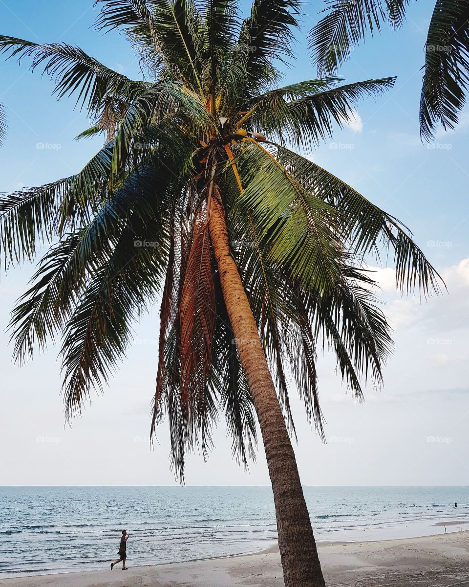 Man walking on paradise beach