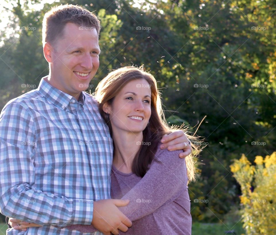 Young man and woman with back lighting 